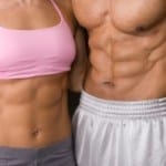Cuts Right To The Core: Close up photo of a fitness couple's abs.