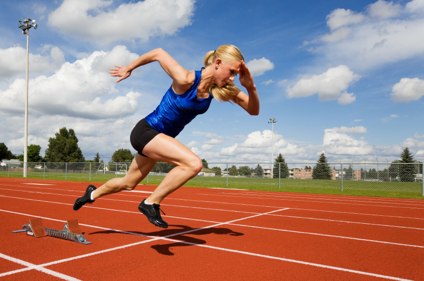 Track athlete exploding out of the starting blocks