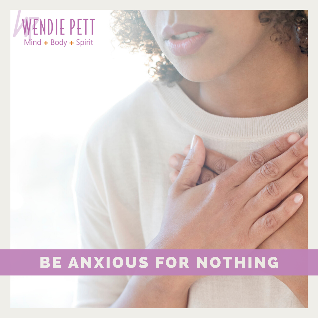 Close up photo of woman with her hands crossed over her heart with a banner that says, "Be anxious for nothing".